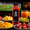 Gulf fruits fresh juice and cut fruits are placed on table top and background is football match