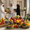 Family presenting gulf fruits premium fresh fruit gift basket in a modern UAE home setting.