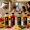 Fresh juice bottles with fruits on a luxury breakfast table with a UAE family enjoying a healthy morning.